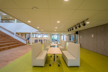 An auditorium in a modern school building for primary school students.