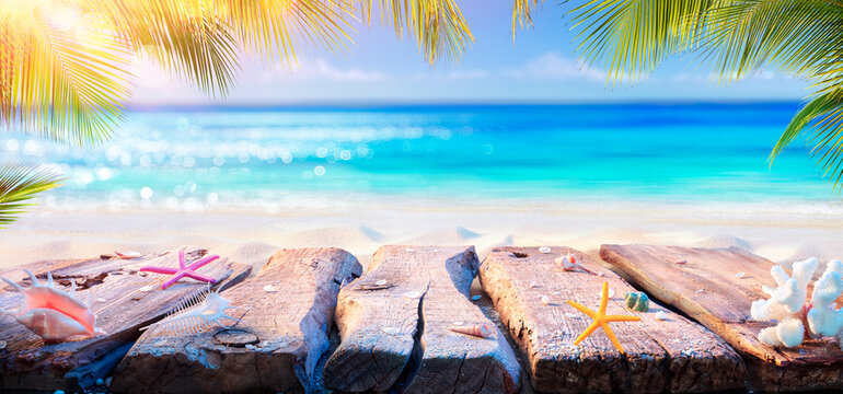 Beach Table With Blurred Ocean And Palm Leaves - Summer Background