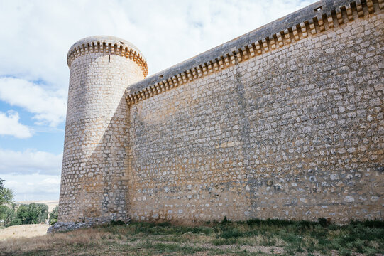 Stone wall with one of the towers of Torrelobaton castle built in the 13th century