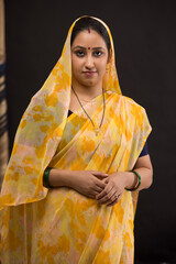 Portrait of a rural woman standing.