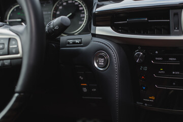 Obraz na płótnie Canvas Close up of steering wheel. Car dashboard.