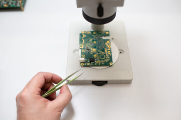 Microscope and electronic circuit board tweezers in Scientific research tech Laboratory