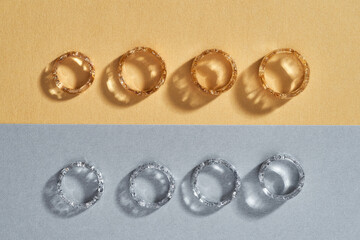 Elegant clear resin rings with golden and silver filling