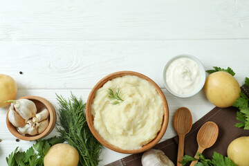 Concept of tasty eating with mashed potatoes on white wooden table