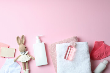 Different baby hygiene accessories on pink background