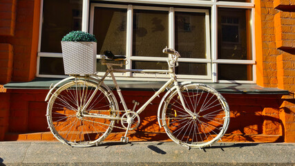 old bicycle in front of a house