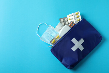 First aid medical kit on blue background