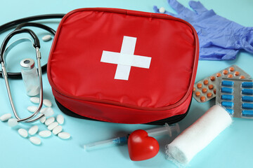 First aid medical kit on blue background