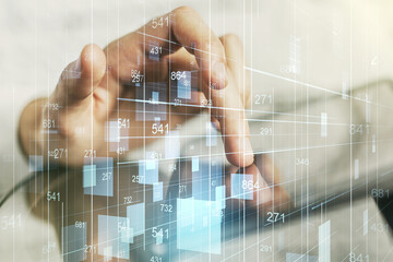 Multi exposure of abstract graphic data spreadsheet sketch and hand working with a digital tablet on background, analytics and analysis concept