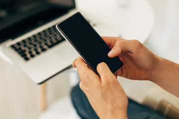 man working with modern devices, man using laptop and mobile phone, business concept