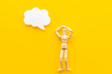 Idea concept. Wooden man figure with speech bubble banner