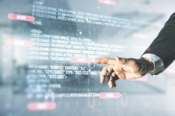 Male hand working with abstract virtual coding concept on blurred office background. Multiexposure