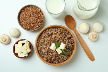Concept of cooking buckwheat on white background