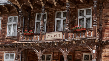 Old wooden museum. Wooden old facade of the house. Facade of the old log house in the of wooden architecture. Selective focus.