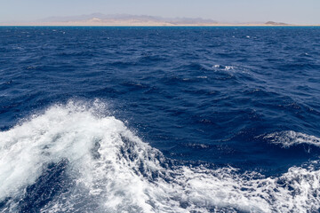 View from the stern of the yacht while sailing.