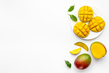 Mango slices and cubes in plate for fresh summer dinner
