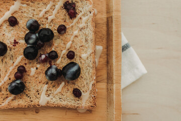 Homemade mixed berries toast breads served on wooden plate.