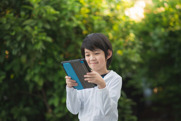 Asian child learning class study online with video call from tablet