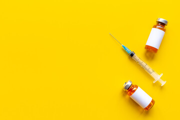 Coronavirus vaccine ampoules with syringe. Vaccination concept