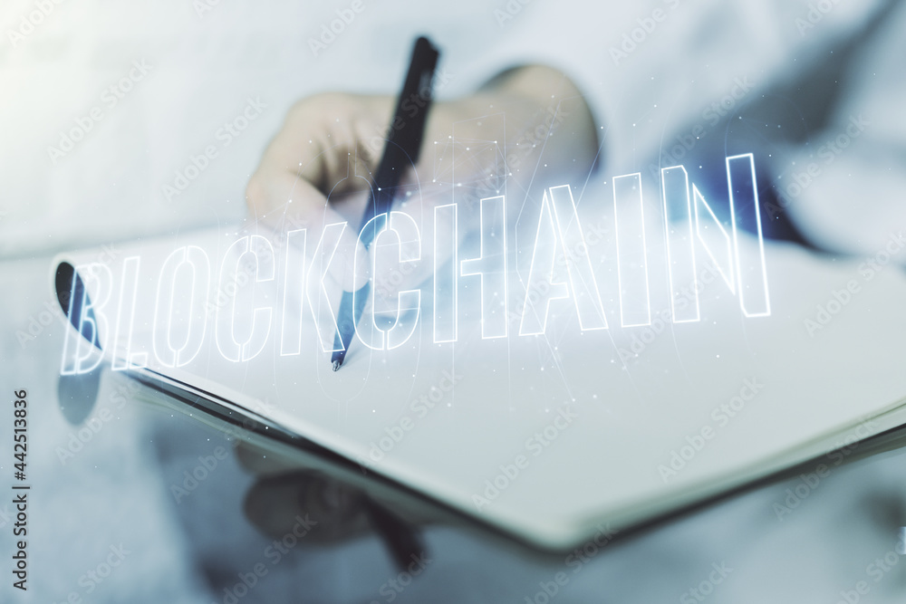 Poster creative concept of blockchain technology and man hand writing in notebook on background. digital mo