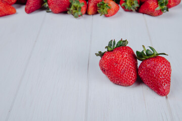 side view of fresh ripe strawberries isolated on white background