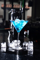 Cocktail on black background. Cocktail at the bar. Alcoholic drink at the night club.