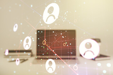 Double exposure of social network icons concept with modern laptop on background. Marketing and promotion concept