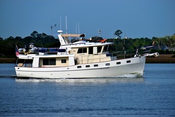Fototapeta na wymiar Luxury boat cruising along the river at St. Augustine, Florida