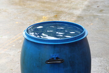 Barrel of water filled upto its top surface from rain water from roof. Rain water harvesting or...