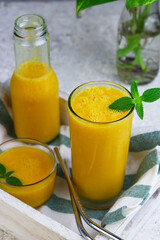 Fototapeta premium Mango Juice or jus mangga on white background. Fresh healthy during during summer holiday. 