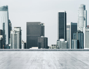 Empty concrete dirty rooftop on the background of a beautiful Los Angeles city skyline at morning, mockup