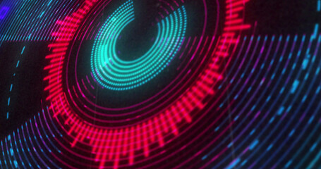 Image of circular red and purple 3d light display flashing and rotating on black background