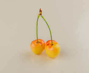side view of yellow ripe cherry isolated on white background