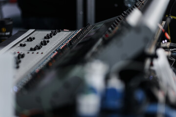 Sound mixer. Professional sound mixing console with backlight, buttons, faders and sliders.