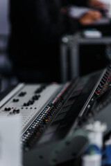 Sound mixer. Professional sound mixing console with backlight, buttons, faders and sliders.