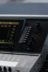Sound mixer. Professional sound mixing console with backlight, buttons, faders and sliders.