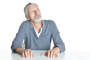 portrait of  senior man  looking up isolated on white background