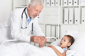  man doctor  and girl in hospital