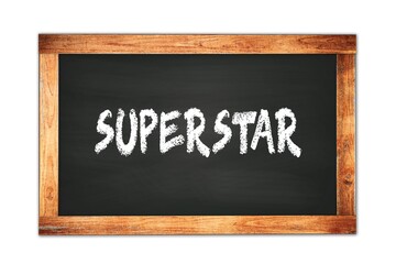 Fototapeta premium SUPERSTAR text written on wooden frame school blackboard.