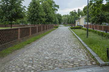 A beautiful landscape of a city park with paths, flower beds and trees