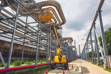 Boom lift working at high in pipeline oil and gas