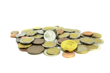 Coins of different countries and different denominations on a white background
