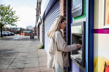 Woman Using ATM