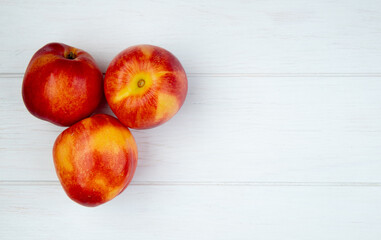 top view of fresh ripe nectarines isolated on white background with copy space