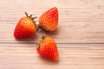 strawberry fruit on wooden background