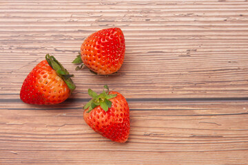 strawberry fruit on wooden background