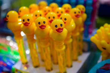 Many toys yellow plastic ducks