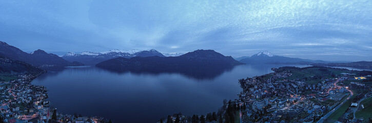 Weggis town, Switzerland. Lake Lucerne. Alps mountains in the snow. Aerial view.