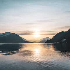 Sunset over Lake Lucerne. Silhouettes of the Alps mountains.