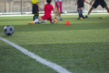 Soccer ball tactics on grass field with children warm up